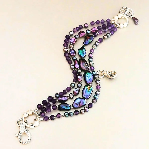 Armband -  pfauenblaue Perlen  - 4 Reihen